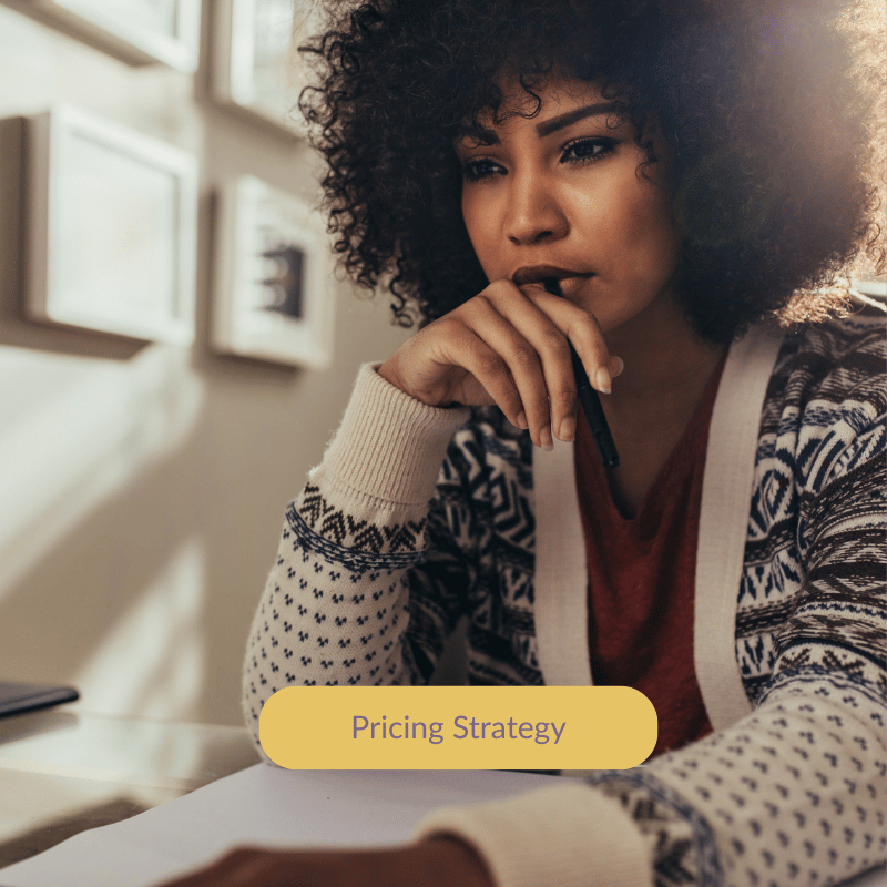 Female founder reviewing pricing strategy with financial data